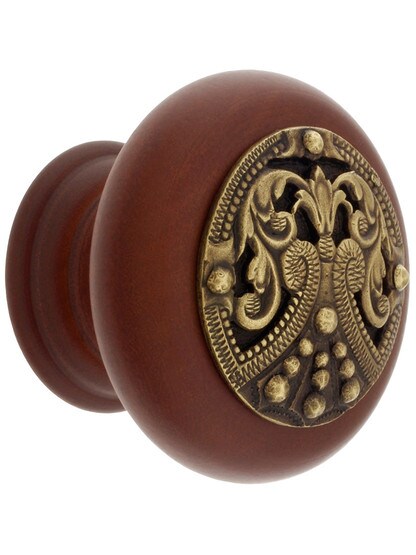 1 1/2 inch Diameter Regal Crest Knobs in Cherry/Antique Brass.